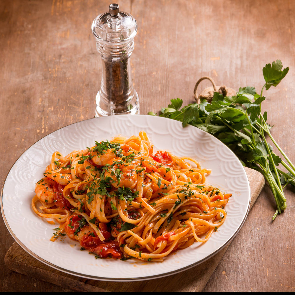 Image of a delicious bowl of pasta with prawns